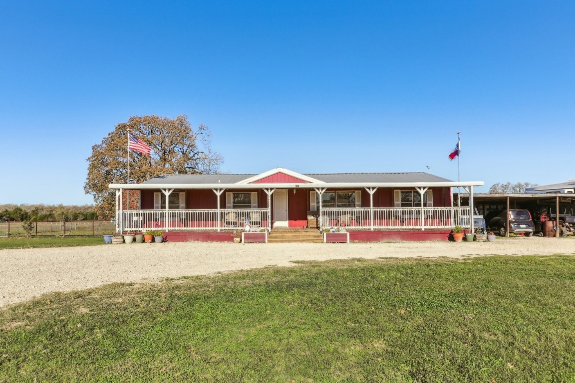 a view of a house with a big yard