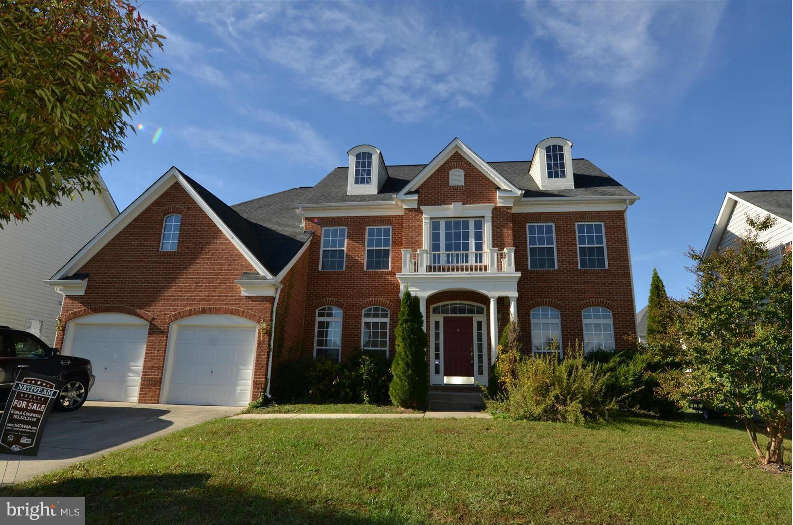 2105 Medinah Ridge Road Accokeek, MD 20607 - Photo 1 of 8 a front view of a house with a yard