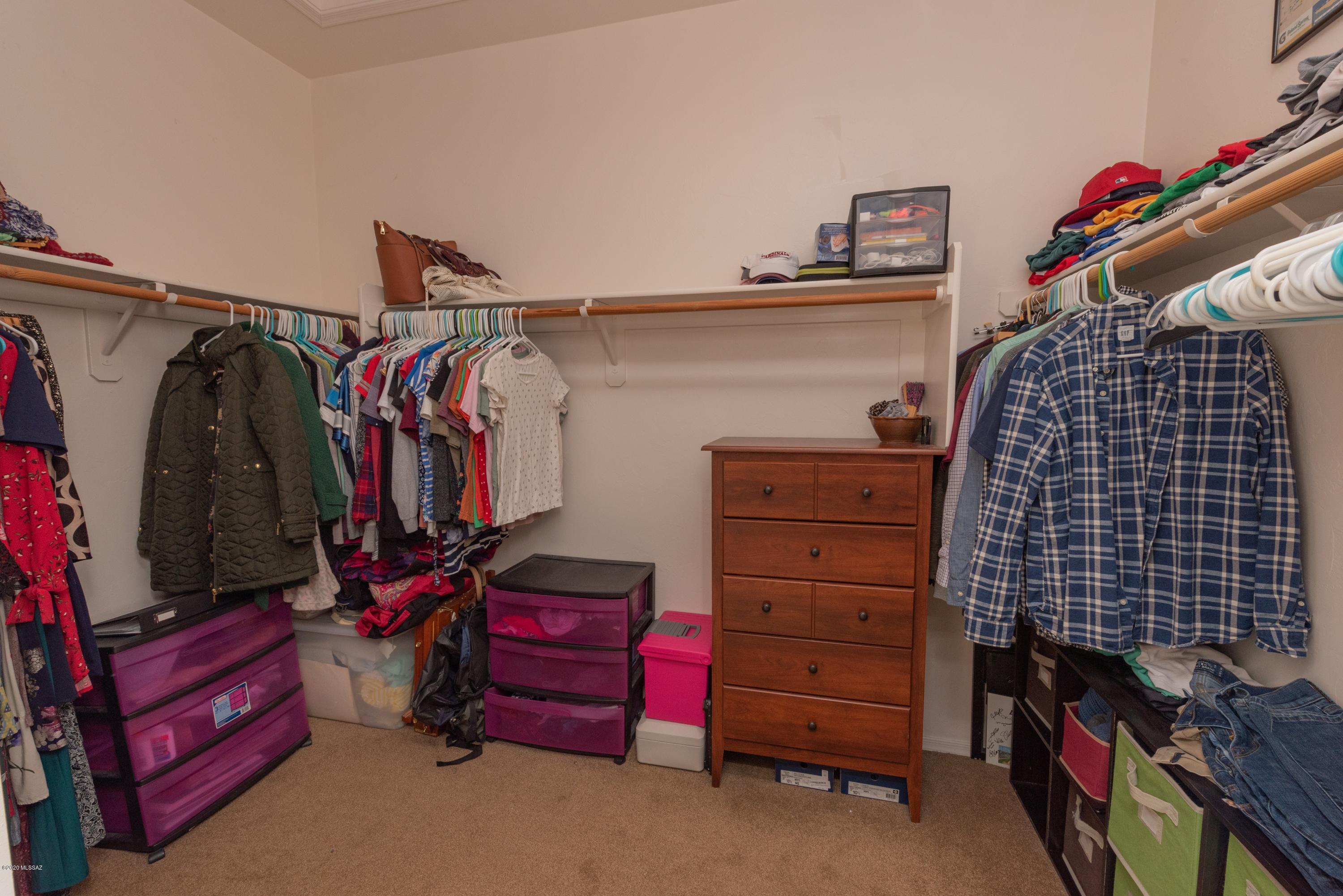 12910 Bloomington Loop Oro Valley, AZ 85755 - Photo 23 of 30 a view of walk in closet with clothes