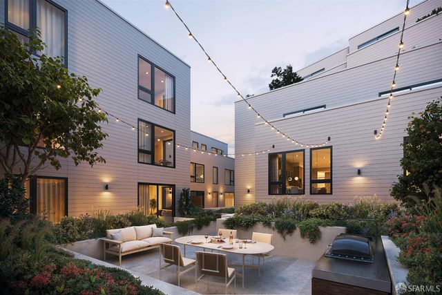 a swimming pool with lots of tress in front of it