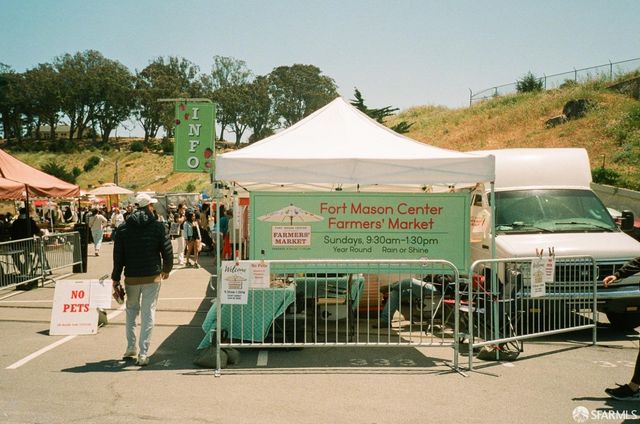 a view of a building with sitting area