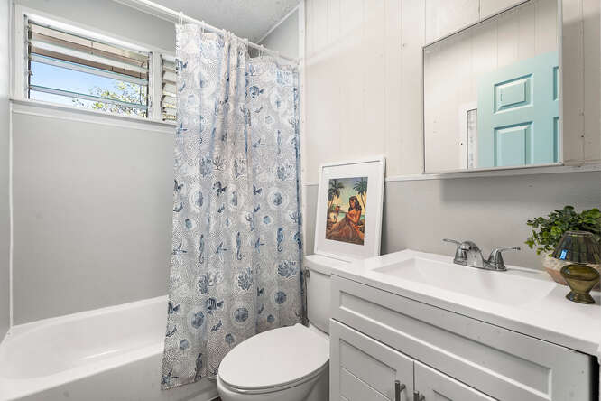 75-164 Lunapule Road Kailua-Kona, HI 96740 - Photo 14 of 27 a bathroom with a sink a toilet and shower
