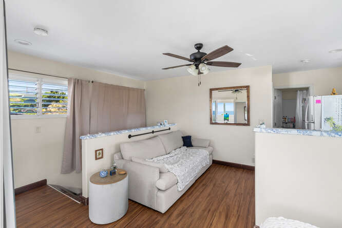75-164 Lunapule Road Kailua-Kona, HI 96740 - Photo 17 of 27 a living room with furniture and a wooden floor