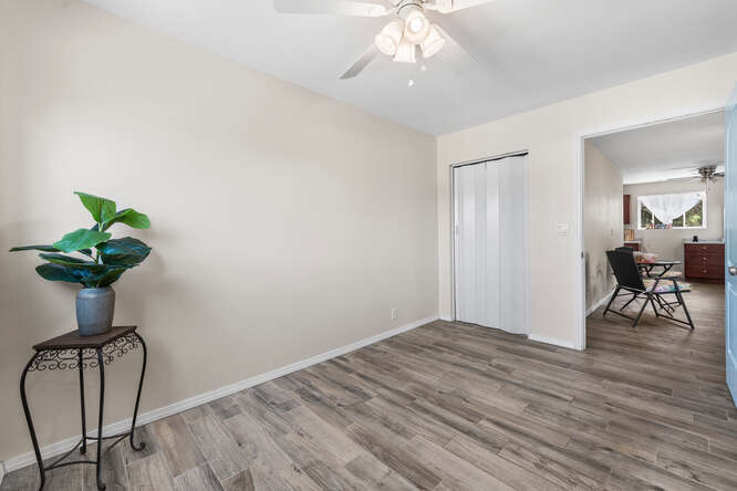 75-164 Lunapule Road Kailua-Kona, HI 96740 - Photo 24 of 27 a view of a room with wooden floor and table