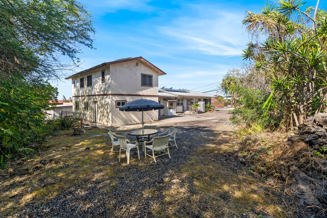 75-164 Lunapule Road Kailua-Kona, HI 96740 - Photo 26 of 27 a view of a house with backyard and sitting area