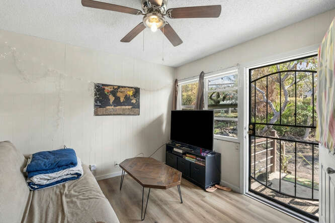75-164 Lunapule Road Kailua-Kona, HI 96740 - Photo 6 of 27 a living room with furniture and a flat screen tv