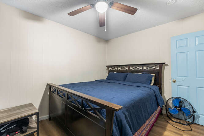 75-164 Lunapule Road Kailua-Kona, HI 96740 - Photo 8 of 27 a bedroom with a bed and a chandelier