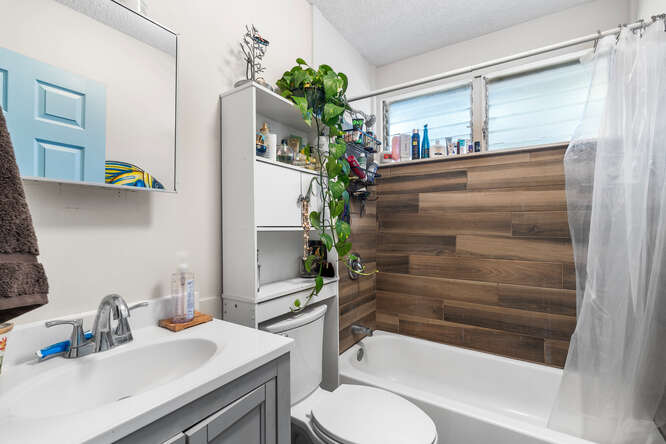 75-164 Lunapule Road Kailua-Kona, HI 96740 - Photo 9 of 27 a bathroom with a sink toilet and shower