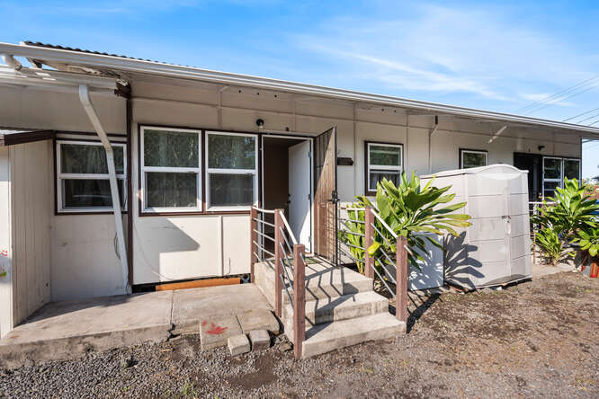 75-164 Lunapule Road Kailua-Kona, HI 96740 - Photo 10 of 27 front view of a house with potted plants and a bench