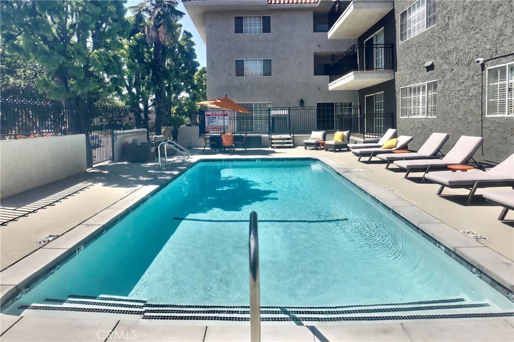 4140 Warner Boulevard, Unit 310 Burbank, CA 91505 - Photo 7 of 18 a swimming pool view with a seating space