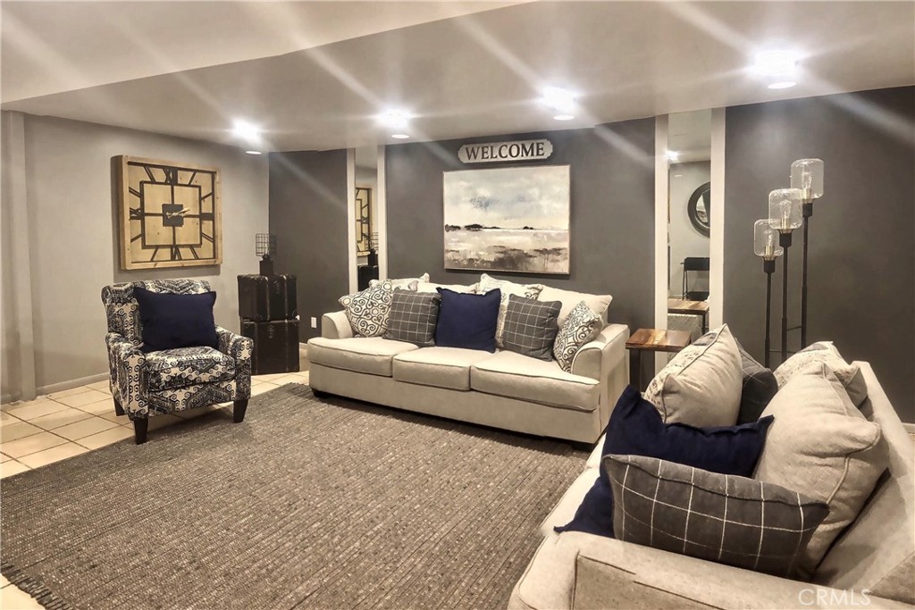 4140 Warner Boulevard, Unit 310 Burbank, CA 91505 - Photo 9 of 18 a living room with furniture and a large window
