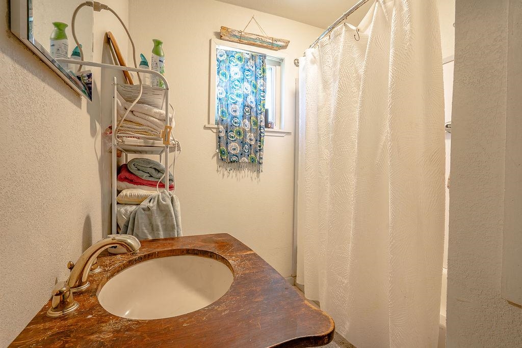 470 Riverside Avenue Chester, CA 96020 - Photo 14 of 25 a bathroom with a sink a toilet and a mirror