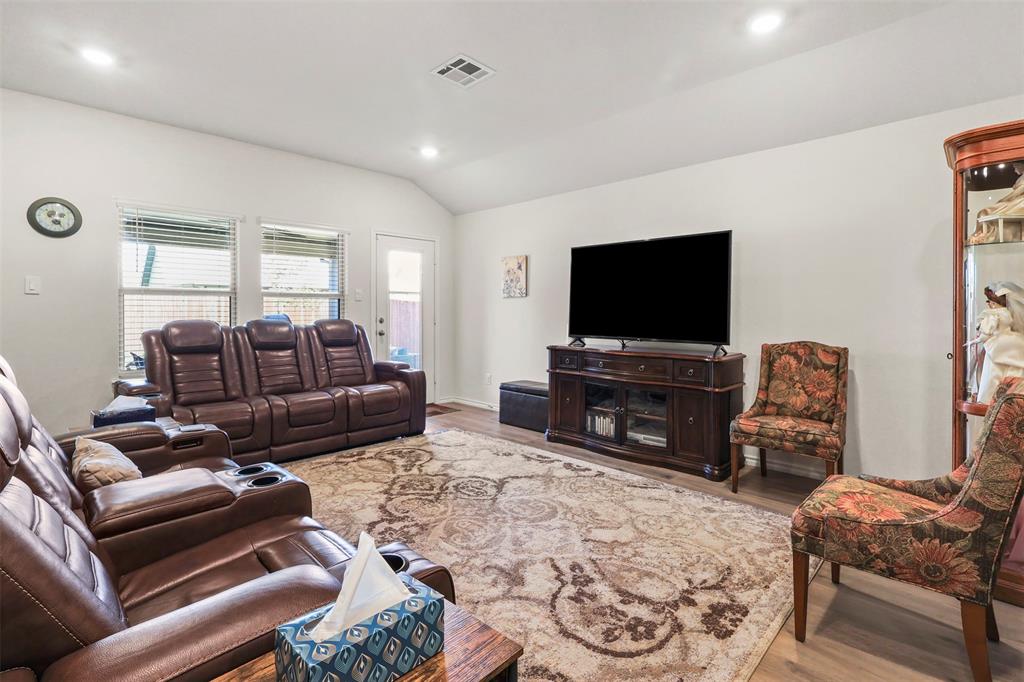 742 Buttercup Drive Pilot Point, TX 76258 - Photo 5 of 20 Living room with light wood finished floors, vaulted ceiling, and recessed lighting