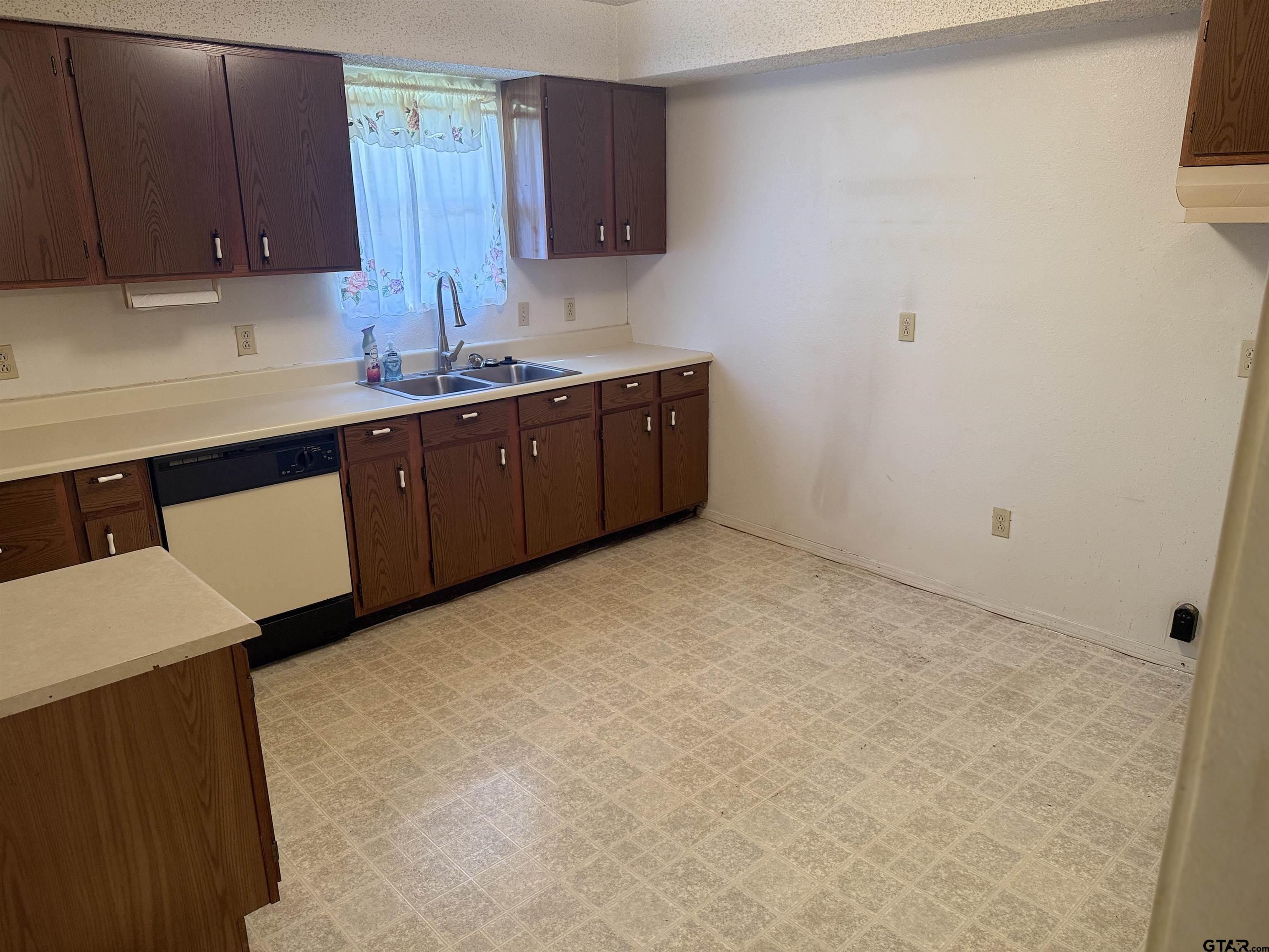226 Caroline Street Rusk, TX 75785 - Photo 16 of 21 a kitchen with a sink and cabinets