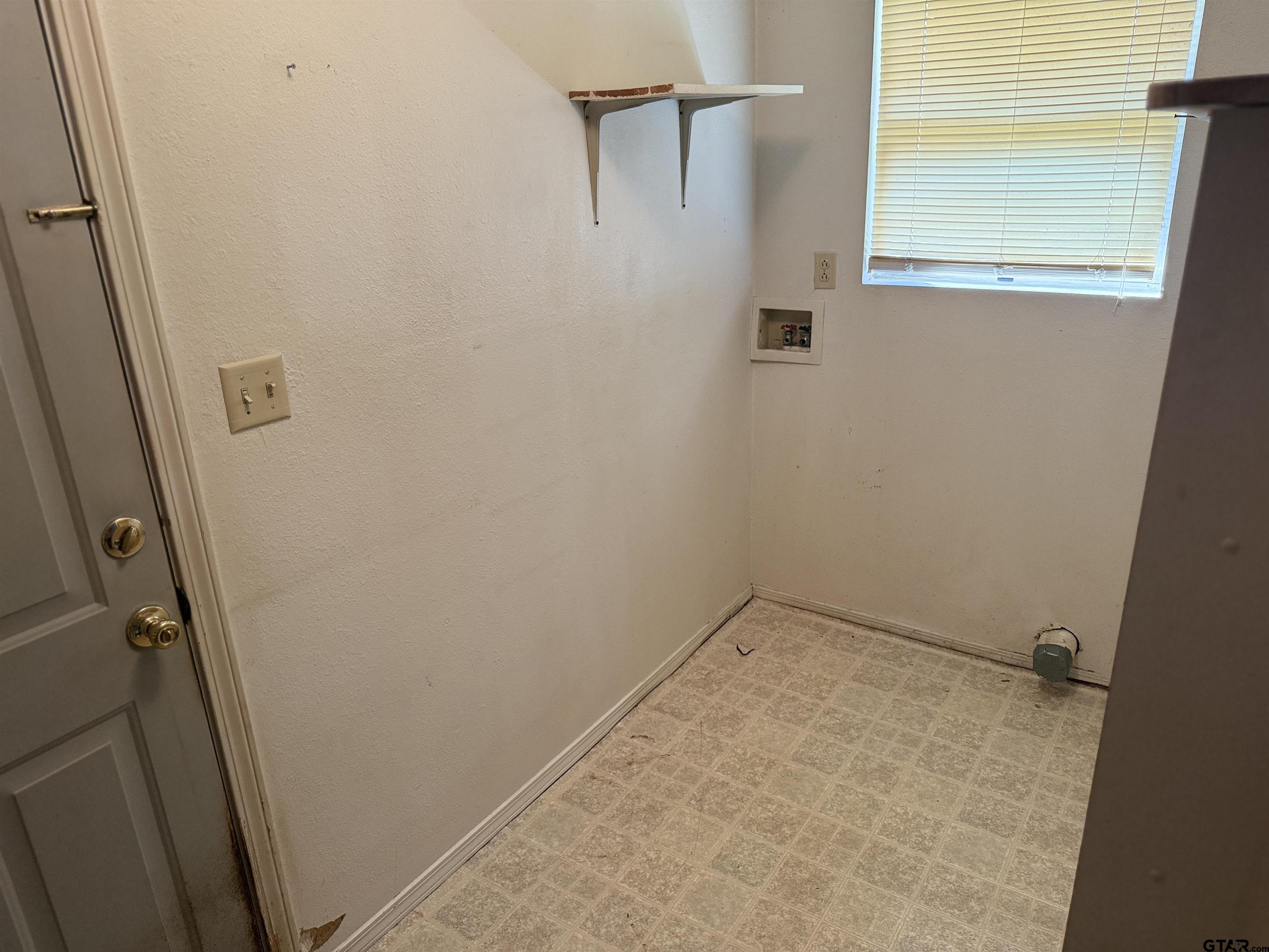 226 Caroline Street Rusk, TX 75785 - Photo 17 of 21 an empty room with a wooden door