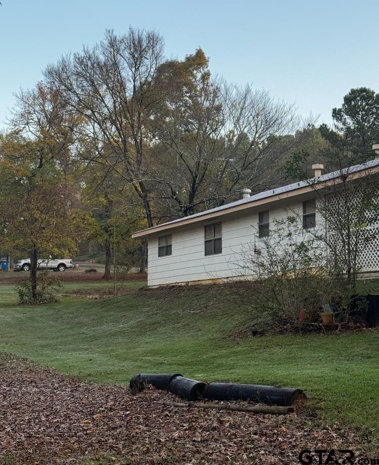 226 Caroline Street Rusk, TX 75785 - Photo 5 of 21 a view of a yard with a house