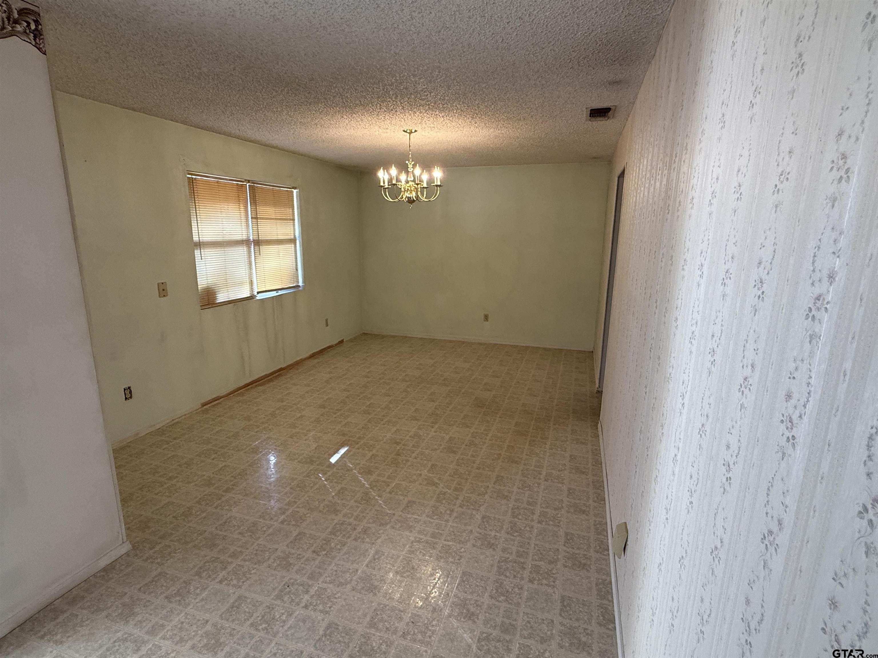 226 Caroline Street Rusk, TX 75785 - Photo 8 of 21 a view of an empty room with a window