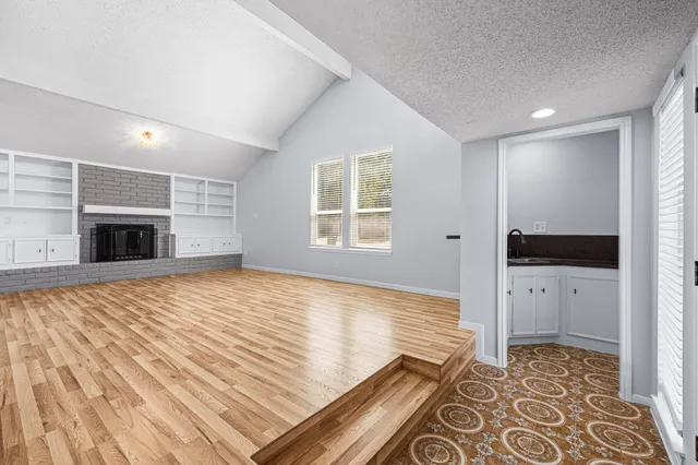 a view of an entryway with wooden floor