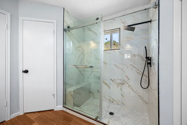 a spacious bathroom with a sink and a mirror