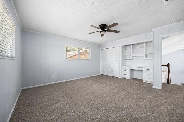 a view of a hallway with stairs