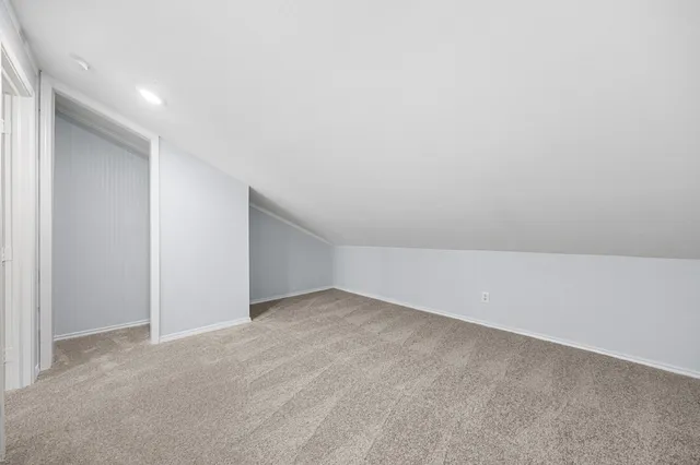 a bathroom with a sink a mirror and shower