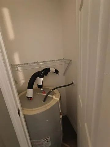 a kitchen with stainless steel appliances granite countertop a sink a refrigerator and a stove