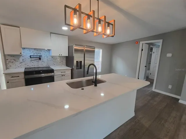 a bathroom with a toilet a sink and a mirror