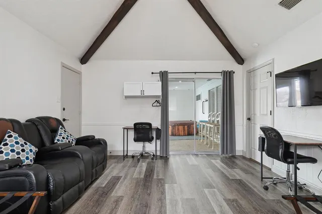 a kitchen with stainless steel appliances a refrigerator and cabinets