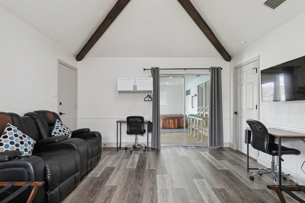 1813 Cross Bend Road Plano, TX 75023 - Photo 12 of 30 a living room with furniture and a wooden floor