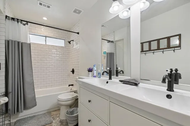 a view of walk in closet with clothes