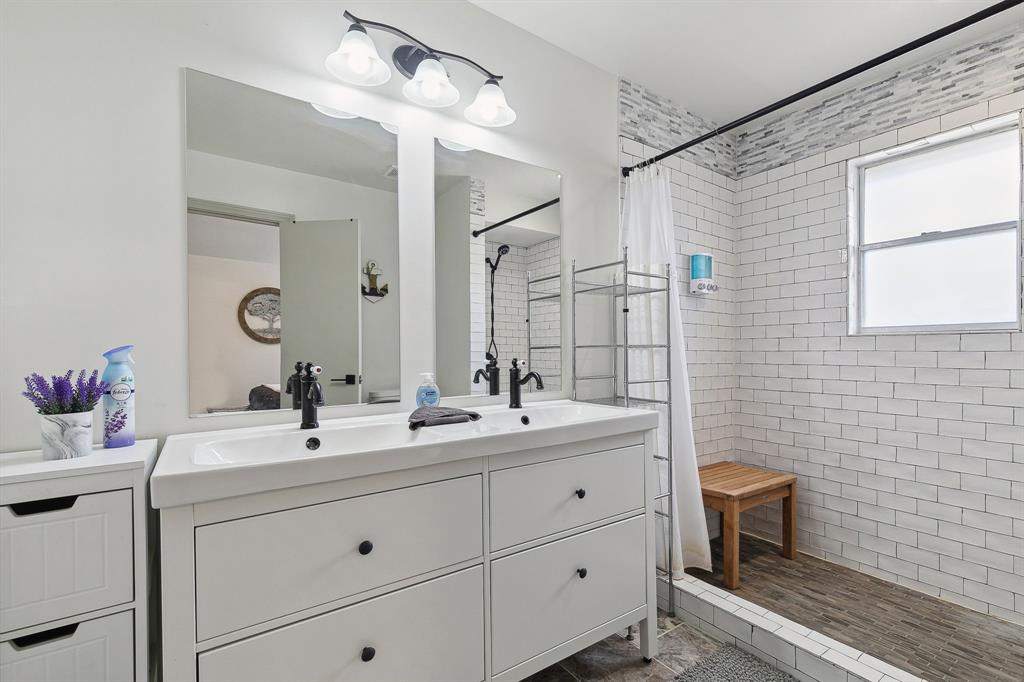 1813 Cross Bend Road Plano, TX 75023 - Photo 21 of 30 a bathroom with a double vanity sink mirror and double