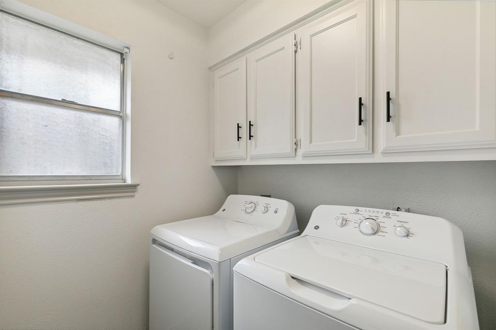 1813 Cross Bend Road Plano, TX 75023 - Photo 28 of 30 a utility room with dryer and washer