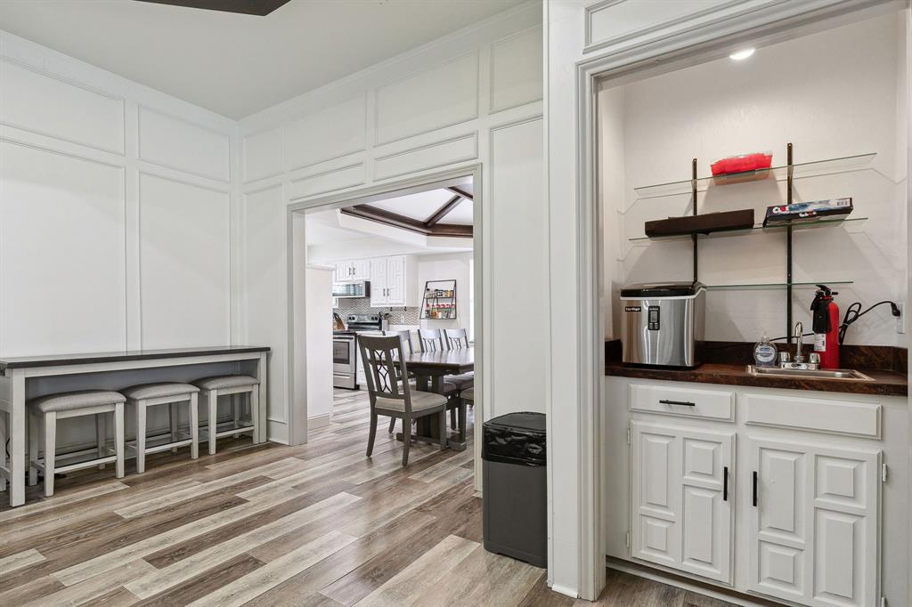 1813 Cross Bend Road Plano, TX 75023 - Photo 29 of 30 a kitchen with stainless steel appliances granite countertop a stove and cabinets