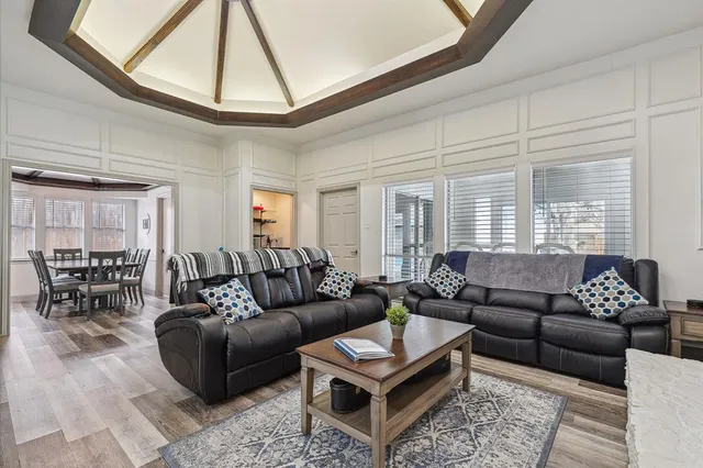 a kitchen with cabinets stainless steel appliances a sink and a window