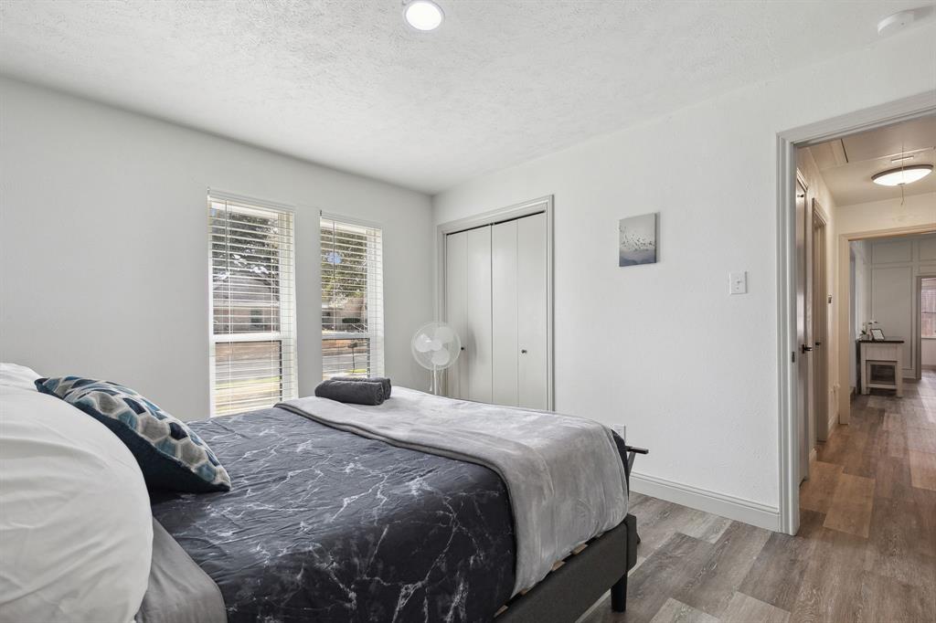 1813 Cross Bend Road Plano, TX 75023 - Photo 6 of 30 a bedroom with a bed and a window