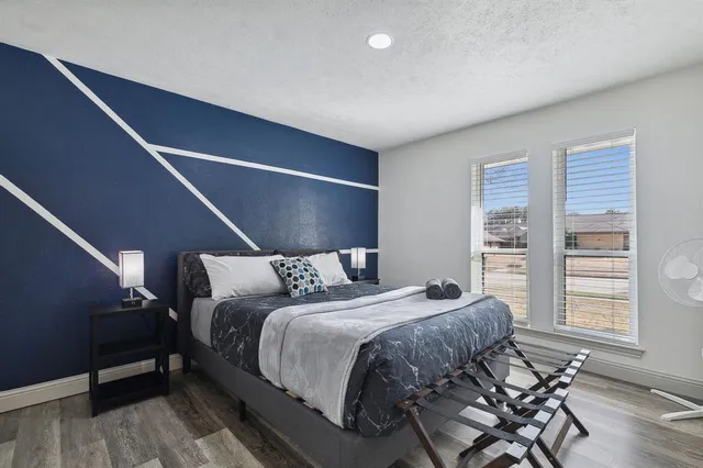 a bedroom with a bed and walk in closet