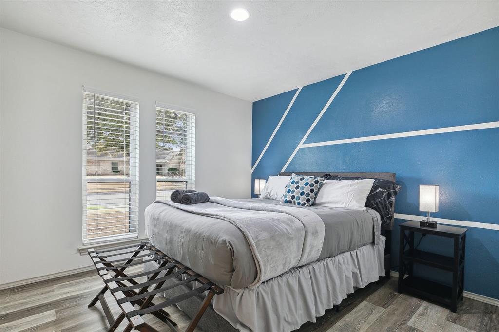 1813 Cross Bend Road Plano, TX 75023 - Photo 9 of 30 a bedroom with a bed and a window