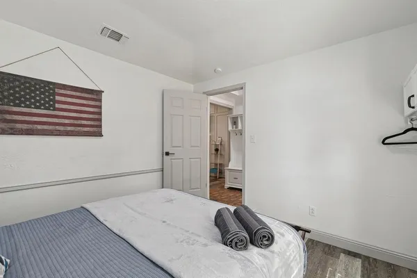 a bedroom with a bed and a window
