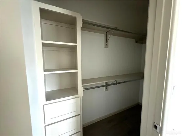 a view of an empty walk in closet