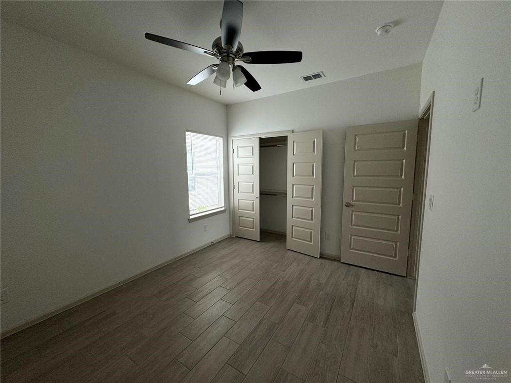 7811 North 58th Street, Unit 3 Mission, TX 78573 - Photo 9 of 11 an empty room with closet and windows