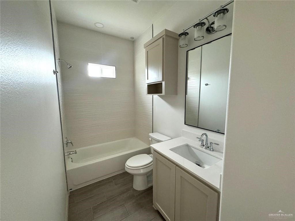 7811 North 58th Street, Unit 3 Mission, TX 78573 - Photo 10 of 11 a bathroom with a sink toilet and shower