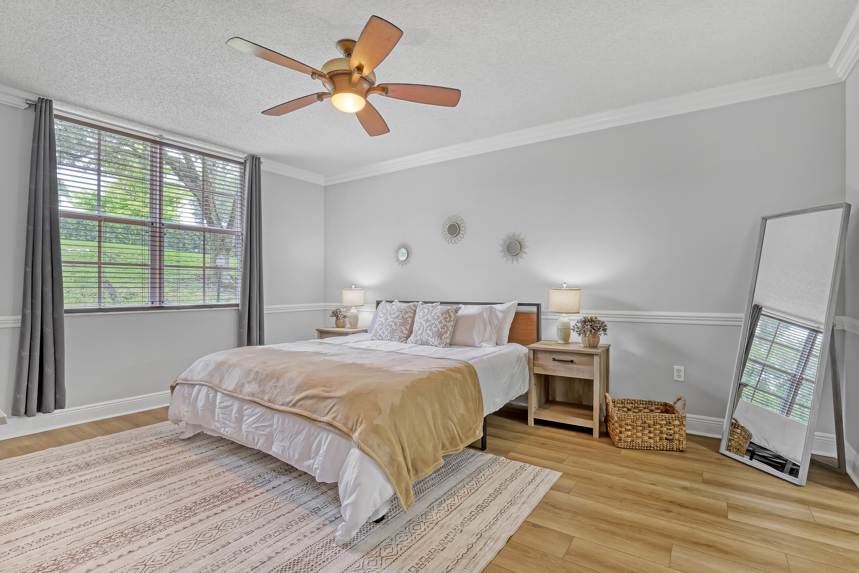 11790 St Andrews Place, Unit 105 Wellington, FL 33414 - Photo 15 of 55 a bedroom with a bed and a large window