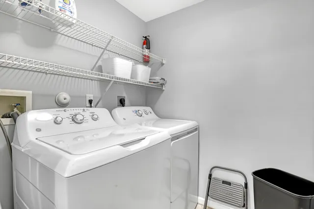 a view of a room with a furniture from a balcony