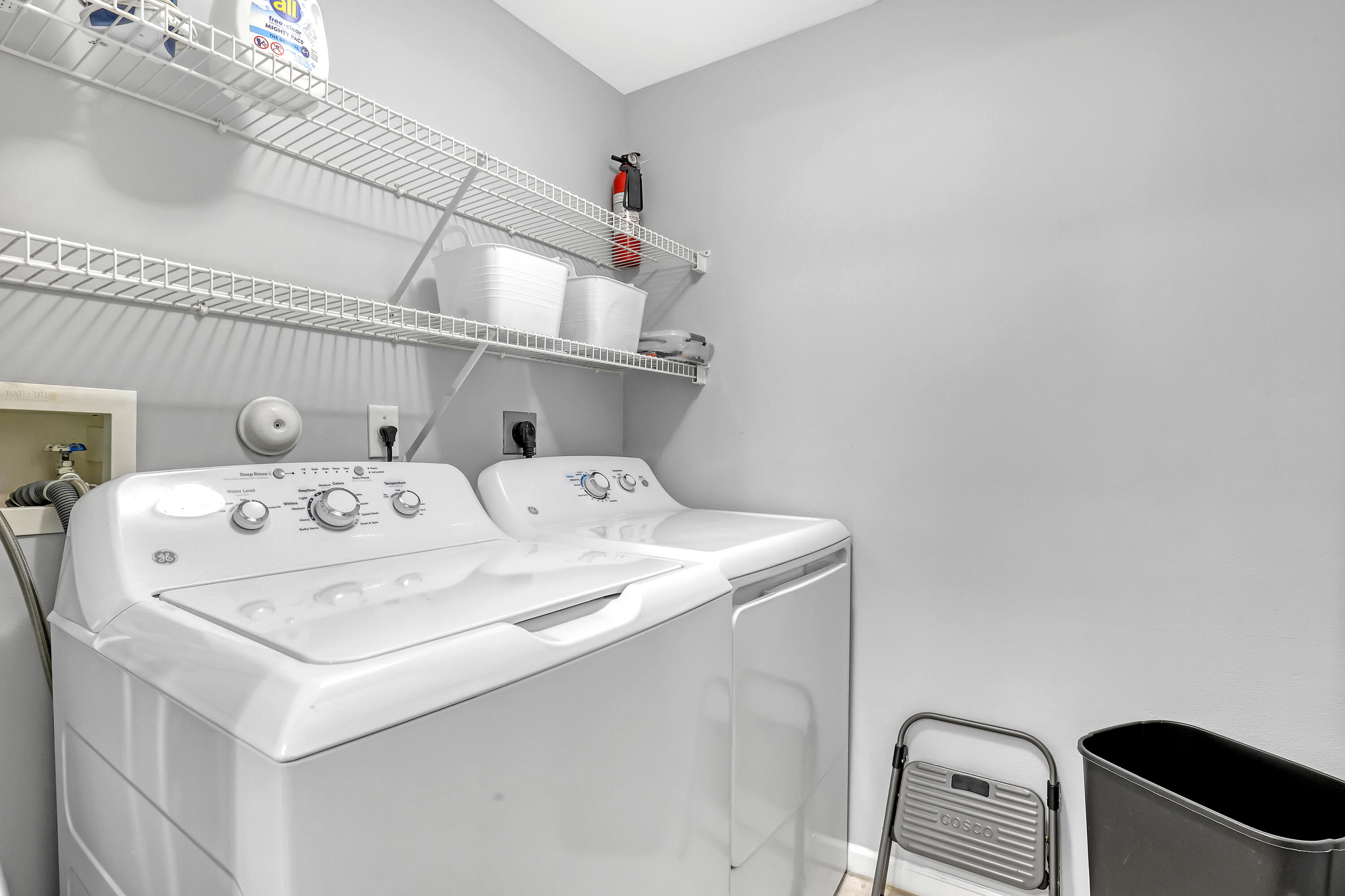 11790 St Andrews Place, Unit 105 Wellington, FL 33414 - Photo 28 of 55 a utility room with dryer and washer