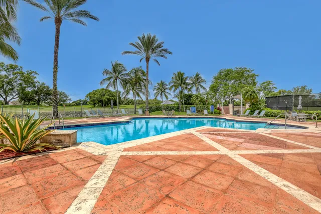 a living room with lots of furniture and a large window