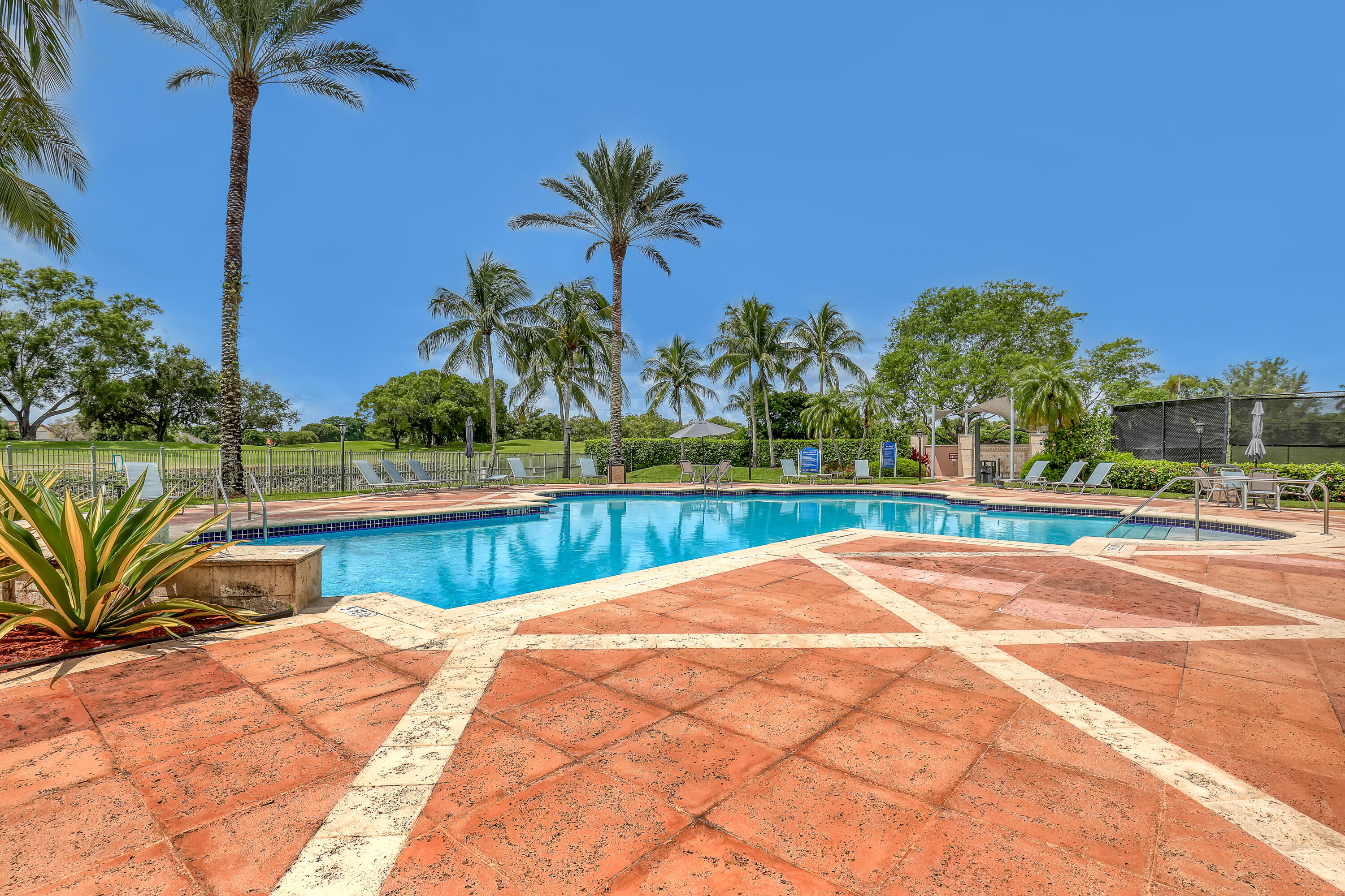 11790 St Andrews Place, Unit 105 Wellington, FL 33414 - Photo 40 of 55 a view of swimming pool with a yard