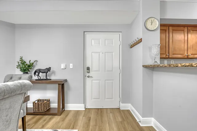 a view of a dining room with furniture and wooden floor