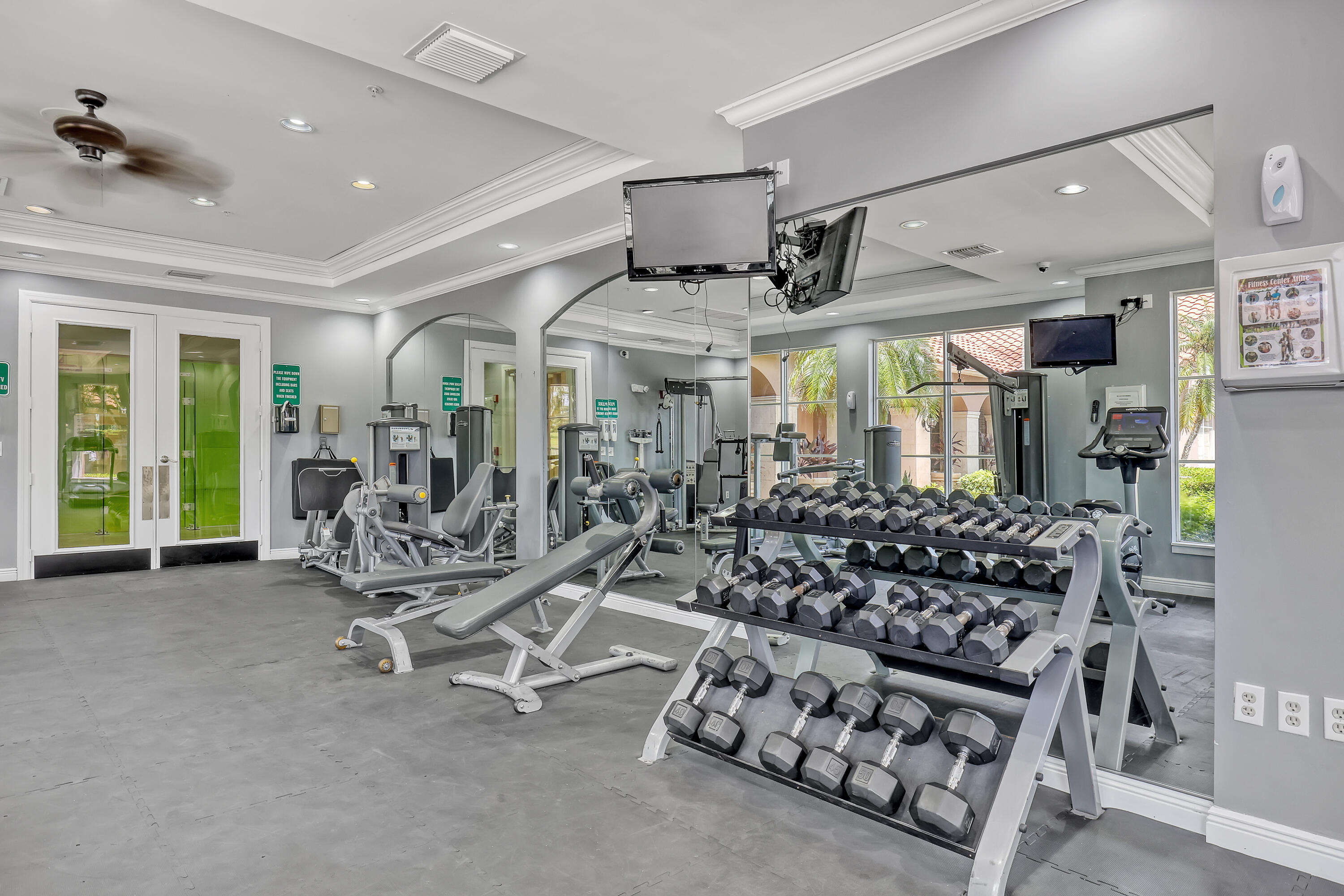 11790 St Andrews Place, Unit 105 Wellington, FL 33414 - Photo 45 of 55 a living room with lots of furniture and a large window