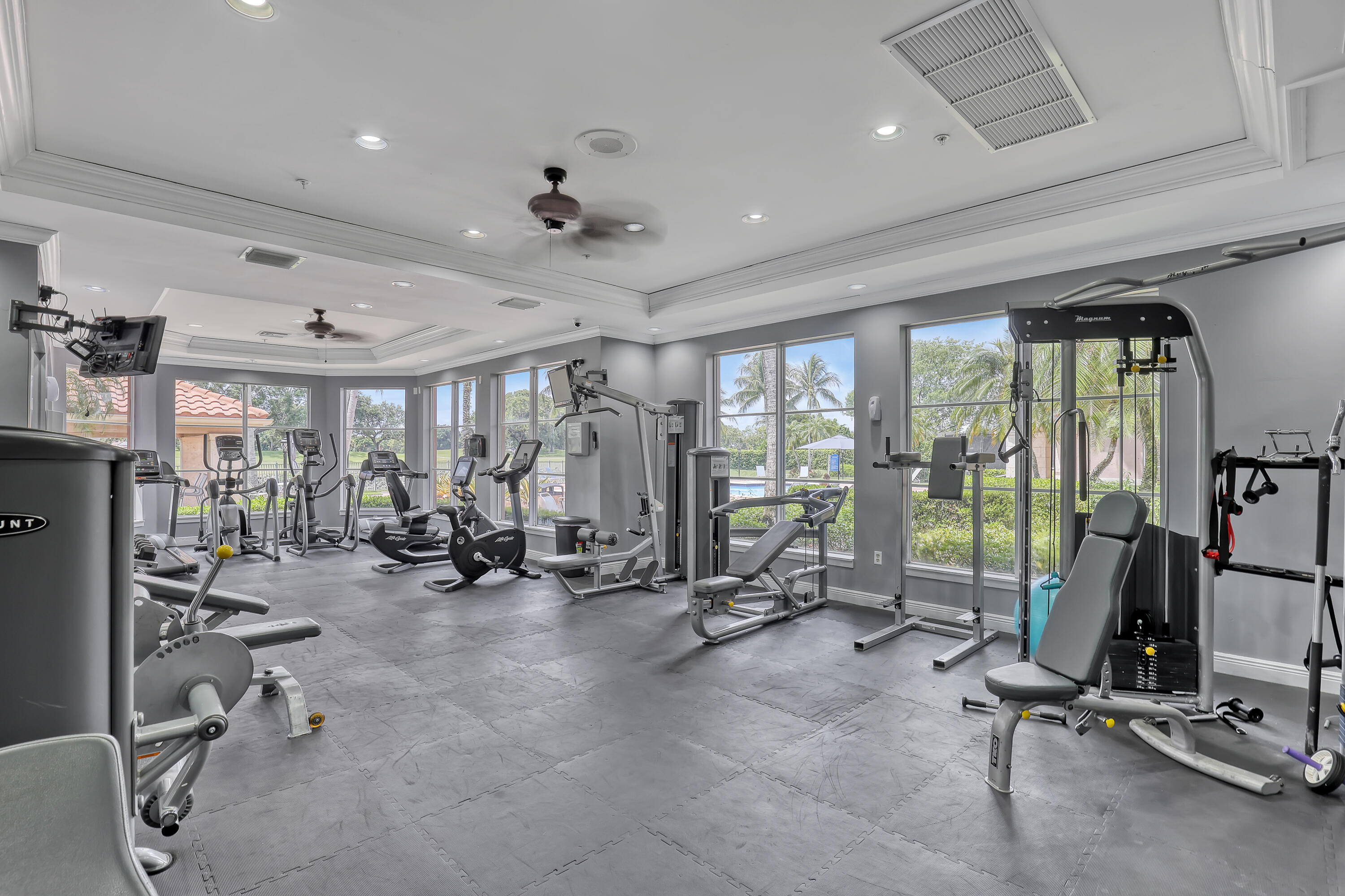 11790 St Andrews Place, Unit 105 Wellington, FL 33414 - Photo 46 of 55 a view of a room with gym equipment