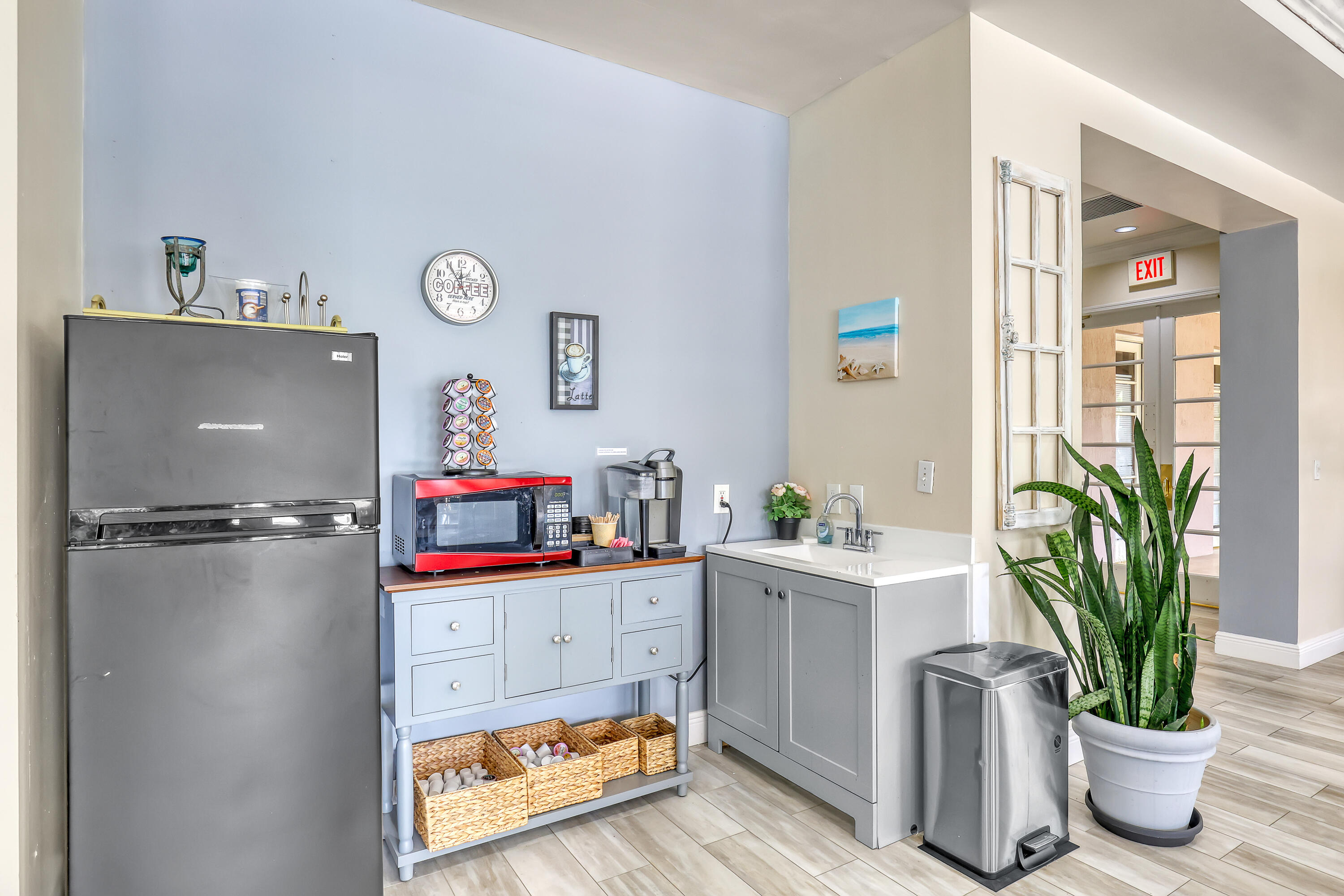 11790 St Andrews Place, Unit 105 Wellington, FL 33414 - Photo 54 of 55 a bathroom with a potted plant on the counter and a sink